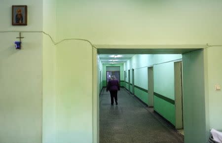 Bulgarian doctor Irena Marinova walks in a corridor at a hospital in the town of Botevgrad January 12, 2015. REUTERS/Stoyan Nenov