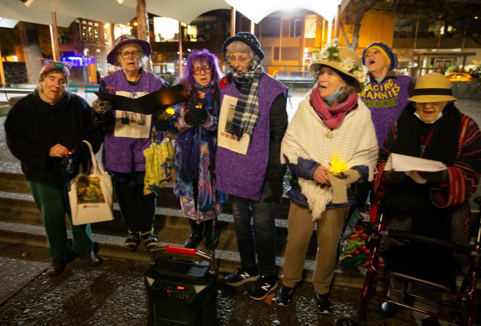 The Raging Grannies sing Amazing Grave during a candlelight vigil for National Homeless Persons’ Remembrance Day in the Park Blocks of Eugene. The event was organized by the Human Rights Commission's Homelessness and Poverty Workgroup and held Wednesday to eulogize members of the community who died while experiencing homelessness during the year.
