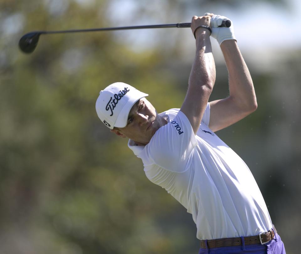 Justin Thomas drives off the first tee during the second round of the Sony Open golf tournament, Friday, Jan. 13, 2017, in Honolulu. (AP Photo/Marco Garcia)