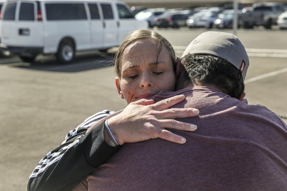 Crystal Allen embraces her son, Martin Allen, upon her release from the Arizona State Prison Complex – Perryville in Goodyear, Ariz., April 18, 2023. Though prisoners working for private companies often are paid minimum wage, some state corrections departments and their prison industries' arms garnish more than 60 percent of workers' earnings. (AP Photo/Dario Lopez-Mills)