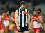 Captain Nick Maxwell of the Magpies leads the team off after losing the round nine AFL match between the Collingwood Magpies and the Sydney Swans at Melbourne Cricket Ground on May 24, 2013 in Melbourne, Australia.