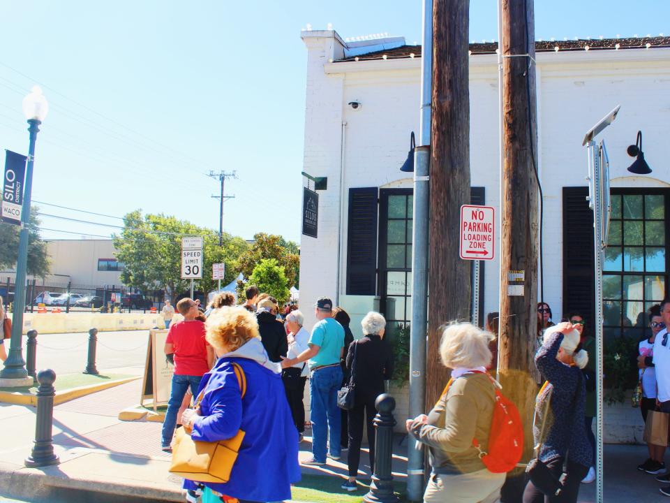 people lined up at magnolia bakery silos waco texas