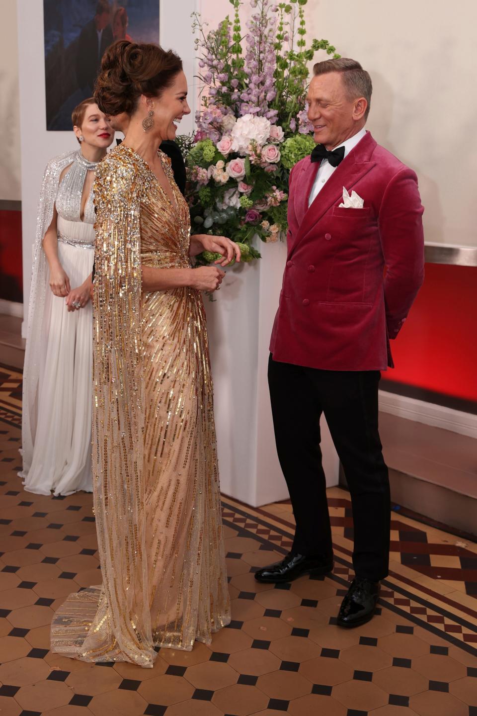 Duchess Kate speaks to British actor Daniel Craig, as they attend the World premiere of the new film from the James Bond franchise 'No Time To Die', in London, on  Sept. 28, 2021.