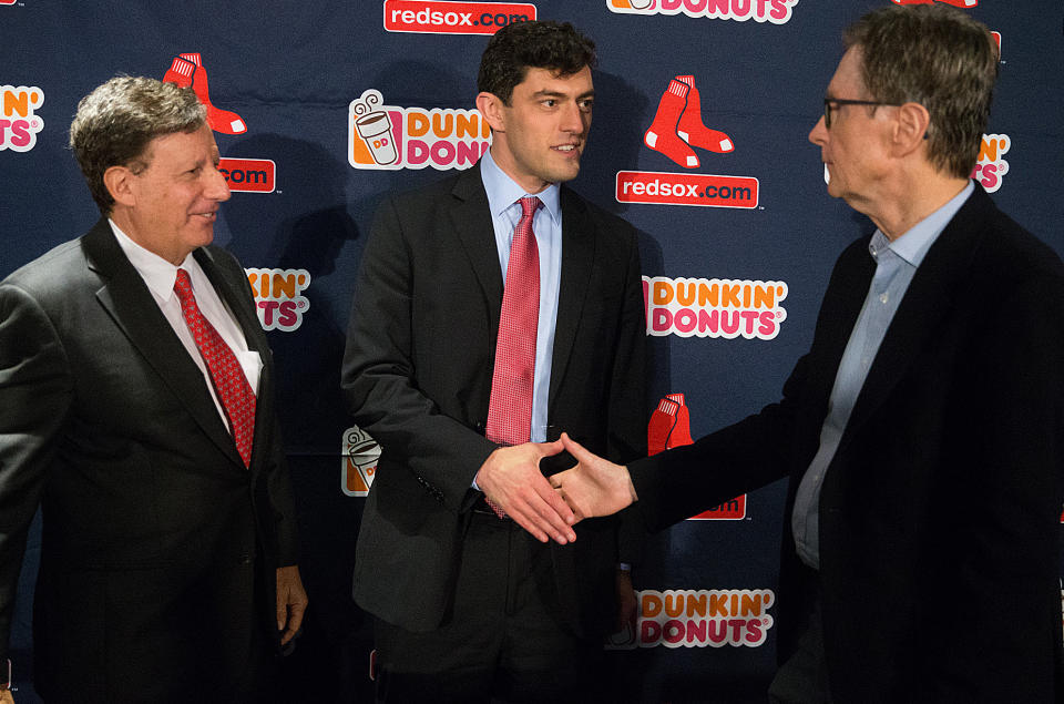 BOSTON, MA. - OCTOBER 28: Chaim Bloom, new Red Sox Chief Baseball Officer shakes hands with John Henry as Tom Werner looks on after a press conference at Fenway Park on October 28, 2019 in Boston, Massachusetts.  