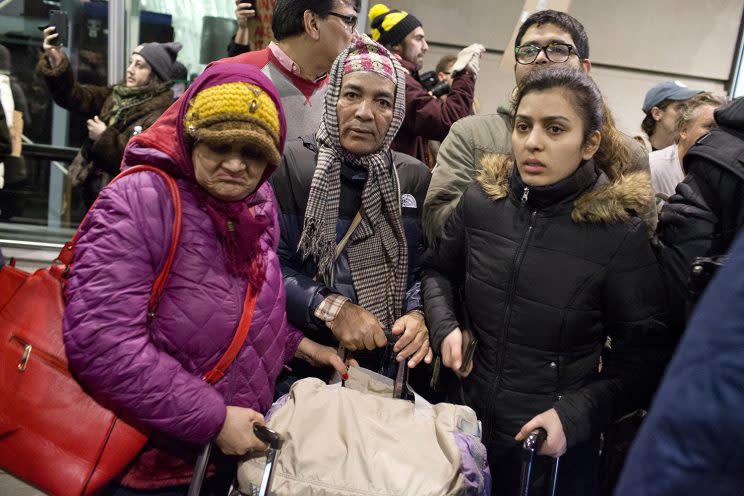 Travelers with visas arrive at John F. Kennedy International Airport in New York on Saturday. (Photo: Andrew Lichtenstein/Corbis via Getty Images)