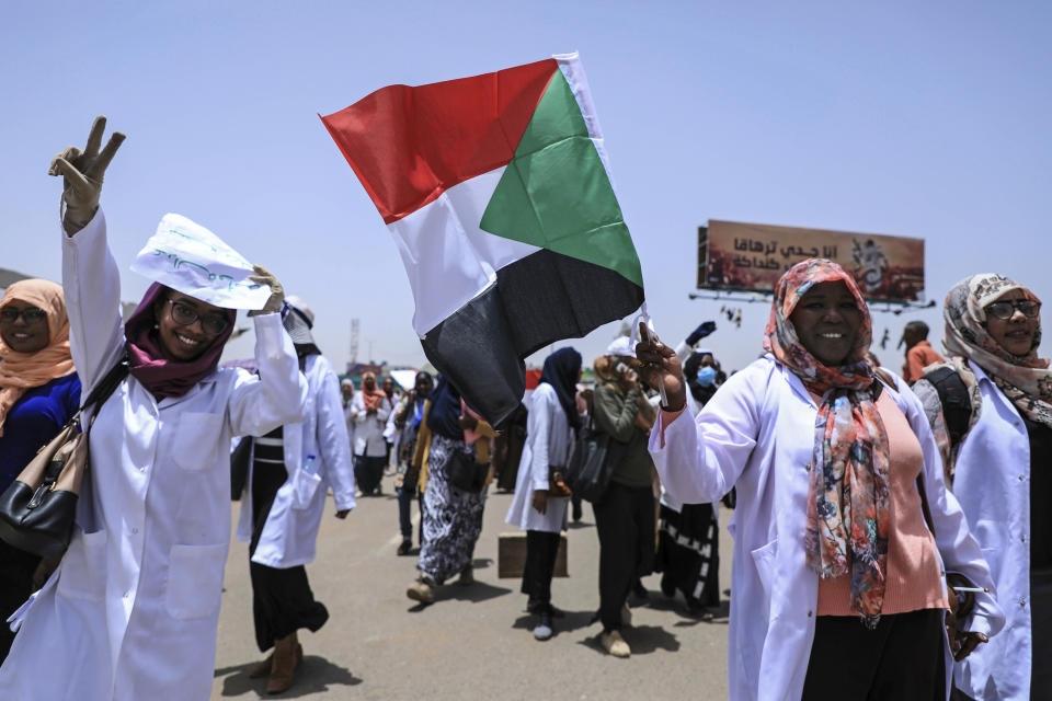 Demonstrators march at a rally outside the army headquarters in the Sudanese capital Khartoum on Wednesday, April 17, 2019. A Sudanese official and a former minister said the military has transferred ousted President Omar al-Bashir to the city's Kopar Prison in Khartoum. The move came after organizers of the street protests demanded the military move al-Bashir to an official prison. (AP Photo)