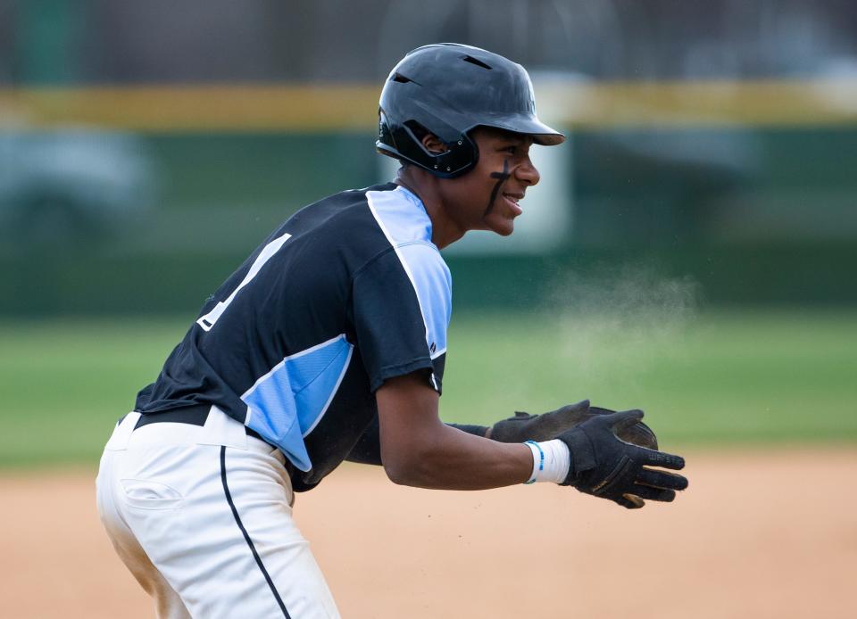 Saint Joseph's Jayce Lee celebrates sliding into third during the Saint Joseph vs. Concord baseball game Tuesday, April 12, 2022 at Concord High School. 