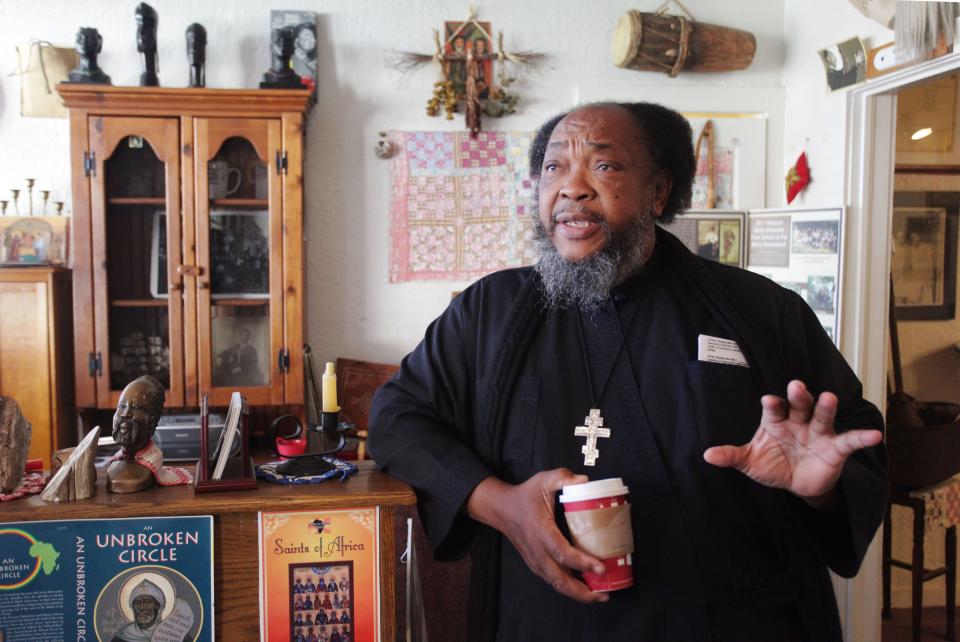 Father Moses Berry explains why the Ozarks Afro-American Heritage Museum in Ash Grove will close. "Something suffers if you have too many irons in the fire," he said. Photographed on Thursday, November 7, 2013.