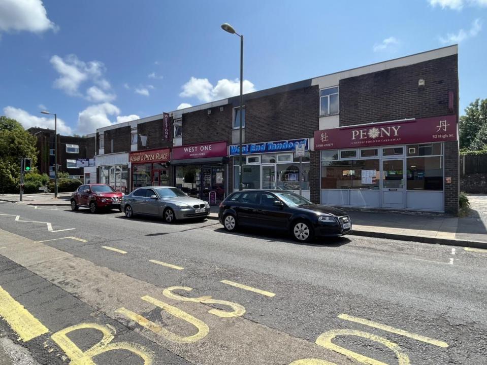 Daily Echo: The row of shops, and the vacant carpet shop, far left, on West End High Street 