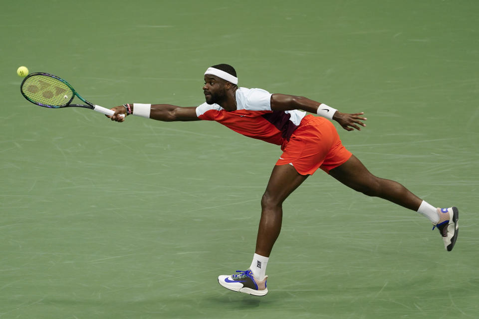 Frances Tiafoe, of the United States, returns a shot to Andrey Rublev, of Russia, during the quarterfinals of the U.S. Open tennis championships, Wednesday, Sept. 7, 2022, in New York. (AP Photo/Seth Wenig)