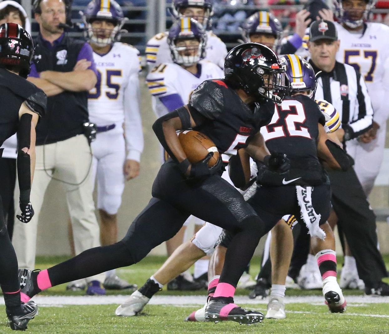 McKinley's Dante McClellan returns an interception 69 yards for a touchdown during a high school football game against Jackson at Tom Benson Hall of Fame Stadium on Friday, Oct. 7, 2022.