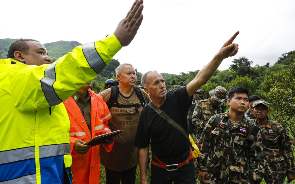 British caver Vernon Unsworth, centre, worked with the Thai army and local rescue teams during the daring operation - AFP