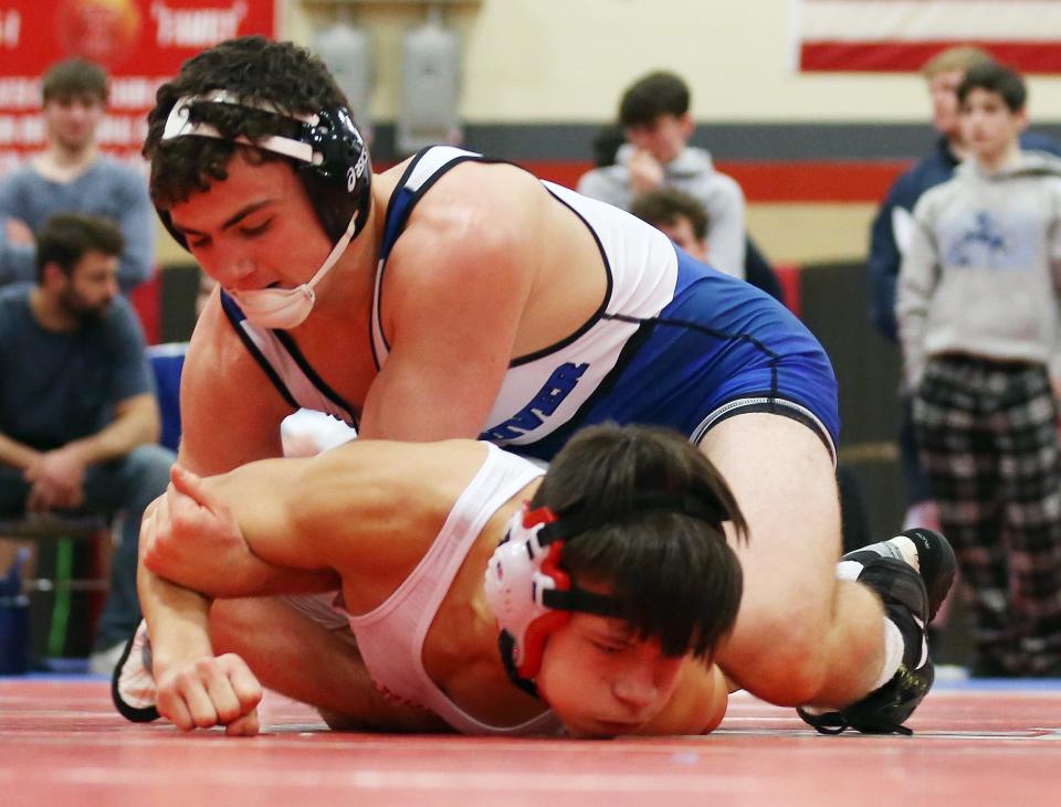 Pearl River's Kevin O'Sullivan and North Rockland's Dylan Shelton wrestle in the 160-pound weight class during the Rockland County wrestling championship at Tappan Zee High School Jan. 21, 2023. O'Sullivan won the match.