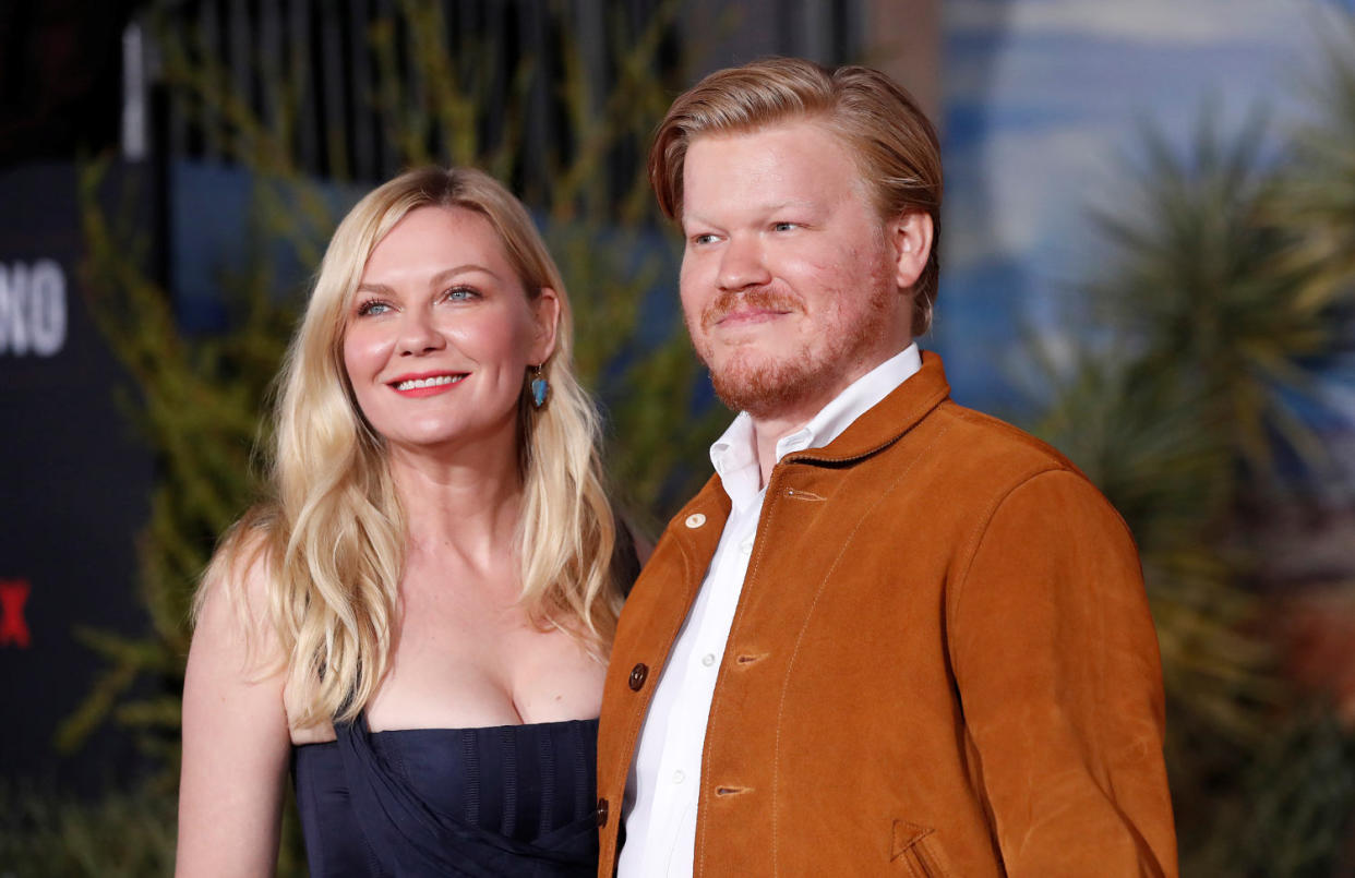 Actors Jesse Plemons and Kirsten Dunst pose at the premiere for 