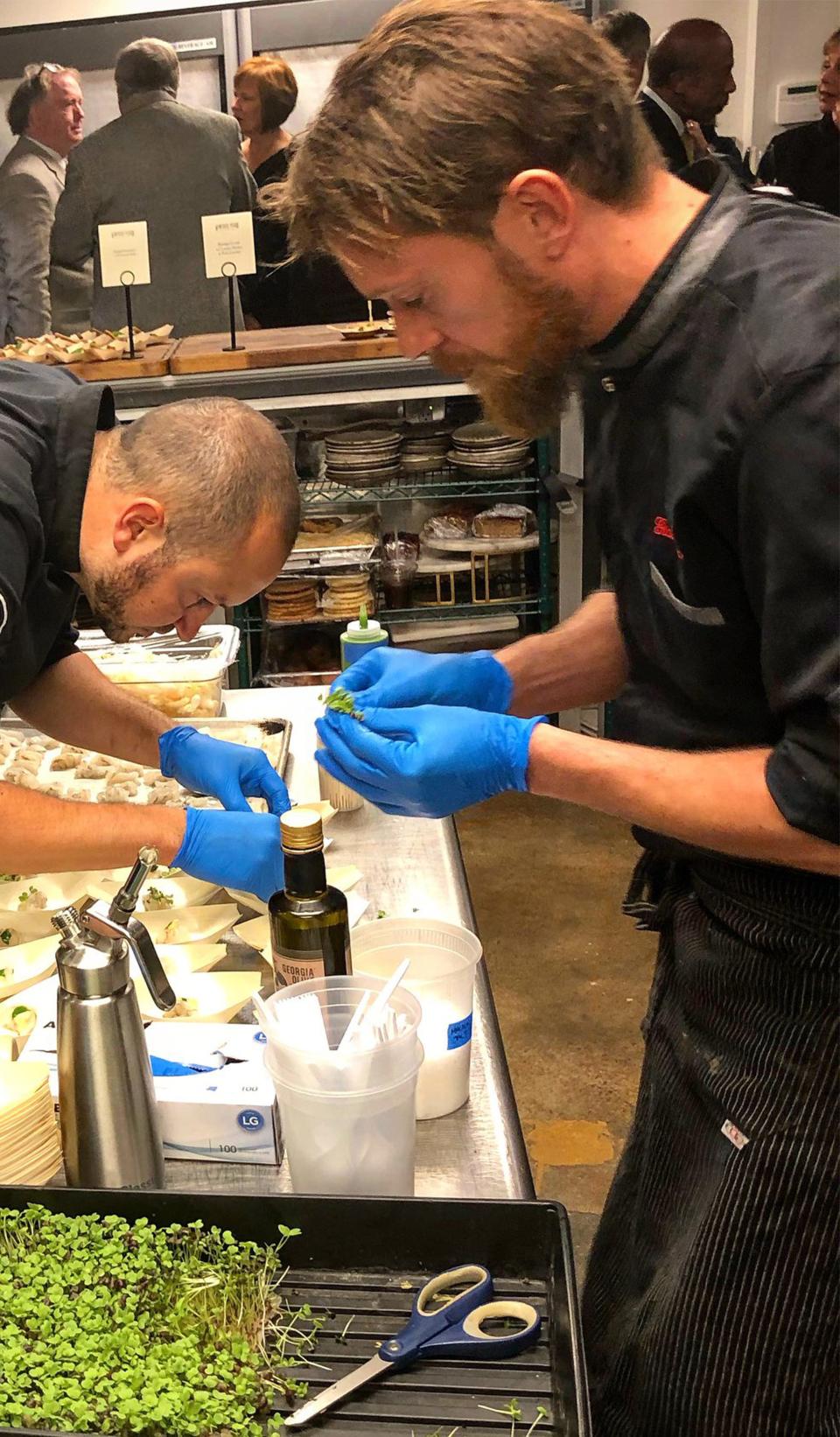 Montgomery chef Eric Rivera, left, and Pietrasanta, Italy, Gianluca Tolla work together in 2019.