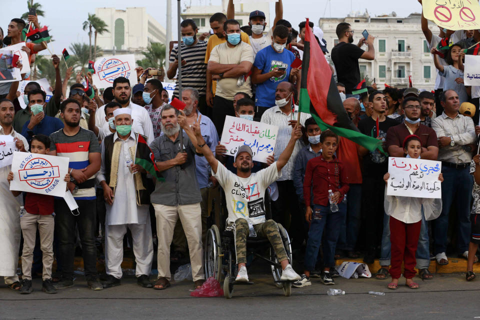 Hundreds of demonstrators protest in Tripoli, Libya, on Friday, Sept. 24, 2021, in opposition to the country’s parliament passing a vote of no-confidence in the transitional government. The motion, passed on Tuesday, represents a challenge to planned December elections and impedes efforts to unite the oil-rich North African nation after a decade of turmoil. (AP Photo/Yousef Murad)