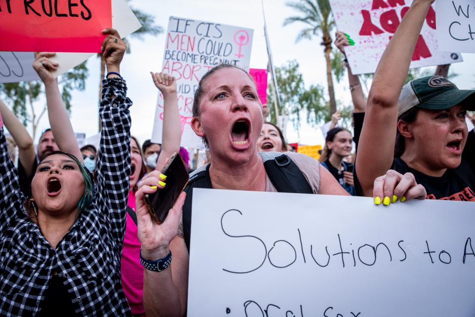 Meggan Sullivan screams (center), along with thousands of abortion-rights demonstrators, against the Supreme Court decision in Dobbs v. Jackson's Women Health Organization outside the Arizona state Capitol in Phoenix on June 24, 2022. The court's decision overturns the 50-year-old Roe v. Wade ruling which established the legal right to abortion in the country.