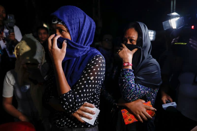 Relatives of the victims of the 2009 Maguindanao Massacre in the southern Philippines arrive at a police headquarters for the promulgation of the case in Taguig City