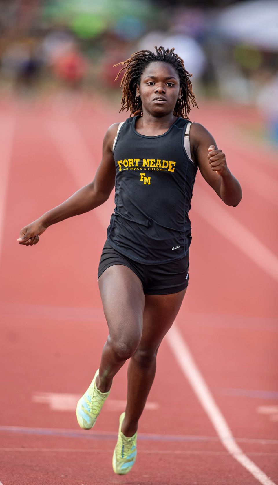 Fort Meade's Azaria Whitehurst win the 100 at the Class 1A, District 10 track and field meet at George Jenkins High School.