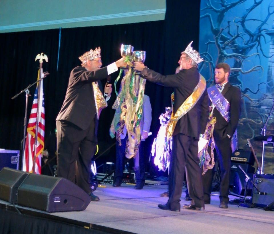 Justinian XXIX King U.S. District Court Judge Maury Hicks toasts Justinian XXX King Caddo Circuit Court Judge Donald E. Hathaway Jr at the krewe's coronation event on August 12, 2023.