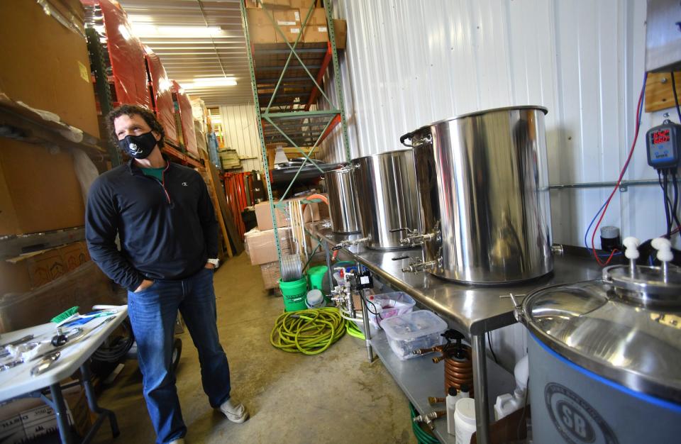 Back Shed Brewing head brewer Chris Simonson stands next to the current small-batch brewing system he uses to develop recipes for future use Friday May 7, 2021, in Waite Park. 