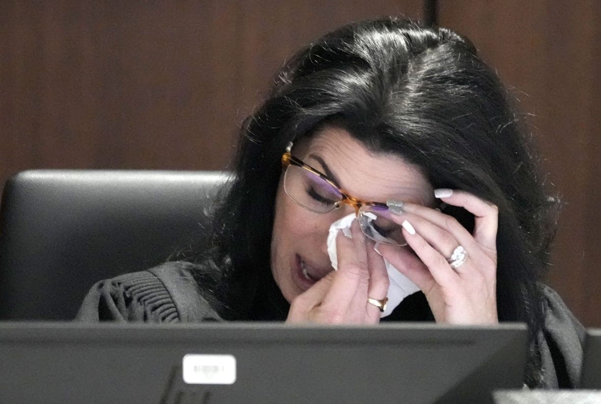 Waukesha County Circuit Court Judge Jennifer Dorow wipes away tears while talking about victim statements during her closing remarks before sentencing Darrell Brooks to 6 consecutive life sentences in a Waukesha County Circuit Court in Waukesha, Wis., on Wednesday, Nov. 16, 2022. (Mike De Sisti/Milwaukee Journal-Sentinel via AP, Pool)