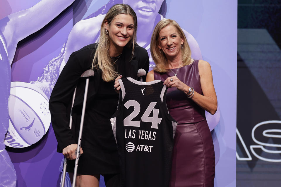 Virginia Tech's Elizabeth Kitley, left, poses for a photo with WNBA commissioner Cathy Engelbert, right, after being selected 24th overall by the Las Vegas Aces during the second round of the WNBA basketball draft on Monday, April 15, 2024, in New York. (AP Photo/Adam Hunger)