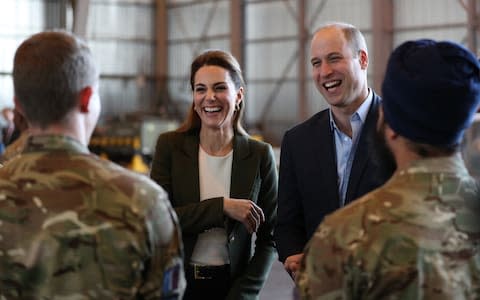 Duke and Duchess of Cambridge talking to British troops - Credit: Getty