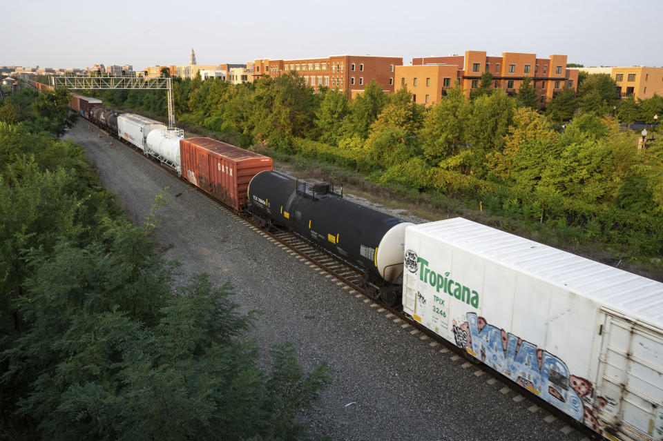 A CSX freight train travels through Alexandria, Va. on Thursday, Sept. 15, 2022. President Joe Biden said Thursday that a tentative railway labor agreement has been reached, averting a strike that could have been devastating to the economy before the pivotal midterm elections.(AP Photo/Kevin Wolf)