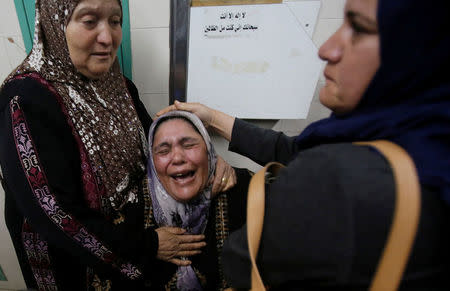 A mother of Palestinian who was killed during clashes with Israeli troops, reacts at a hospital in Hebron, in the occupied West Bank March 9, 2018. REUTERS/Mussa Qawasma