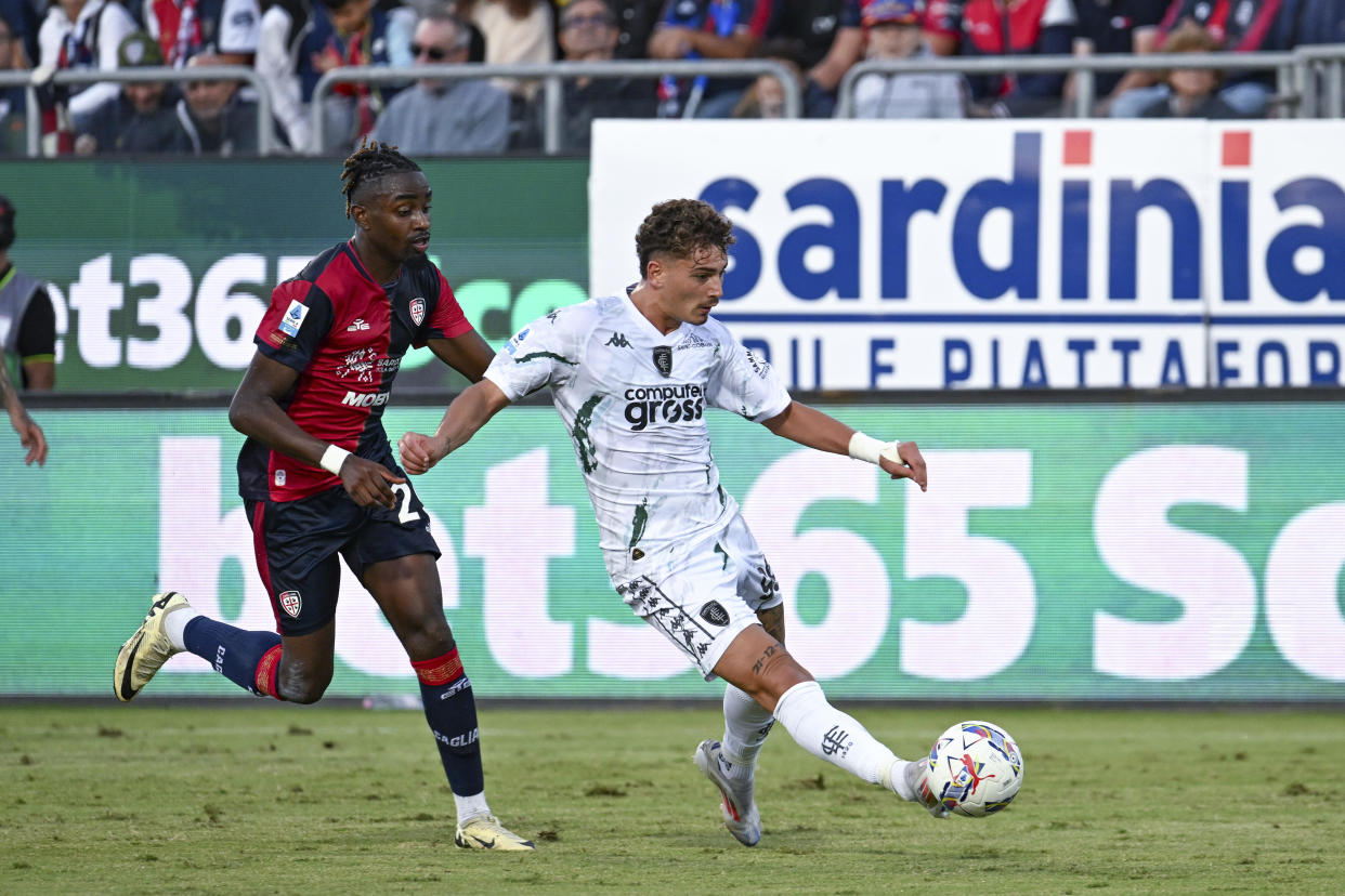 Empoli's Sebastiano Esposito kicks the ball during the Italian Serie A soccer match between Cagliari and Empoli at the Unipol Domus in Cagliari, Italy, Friday, Friday, Sept. 20, 2024. (Gianluca Zuddas/LaPresse via AP)