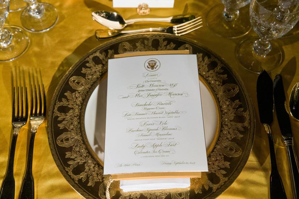 A table is set during a media preview for the State Dinner with President Donald Trump and Australian Prime Minister Scott Morrison in the Rose Garden of the White House, Thursday, Sept. 19, 2019, in Washington.
