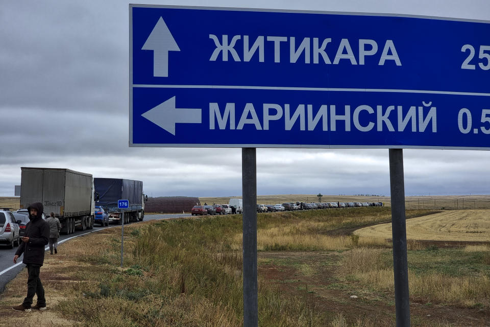 Cars queuing to cross the border into Kazakhstan at the Mariinsky border crossing, about 400 kilometers (250 miles) south of Chelyabinsk, Russia, Tuesday, Sept. 27, 2022. Officials say about 98,000 Russians have crossed into Kazakhstan in the week since President Vladimir Putin announced a partial mobilization of reservists to fight in Ukraine. (AP Photo)