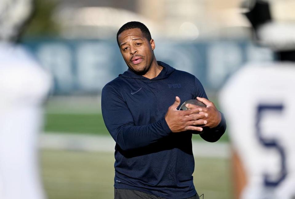 Penn State wide receivers coach Marques Hagans explains a drill during a spring practice on Tuesday, March 21, 2023.