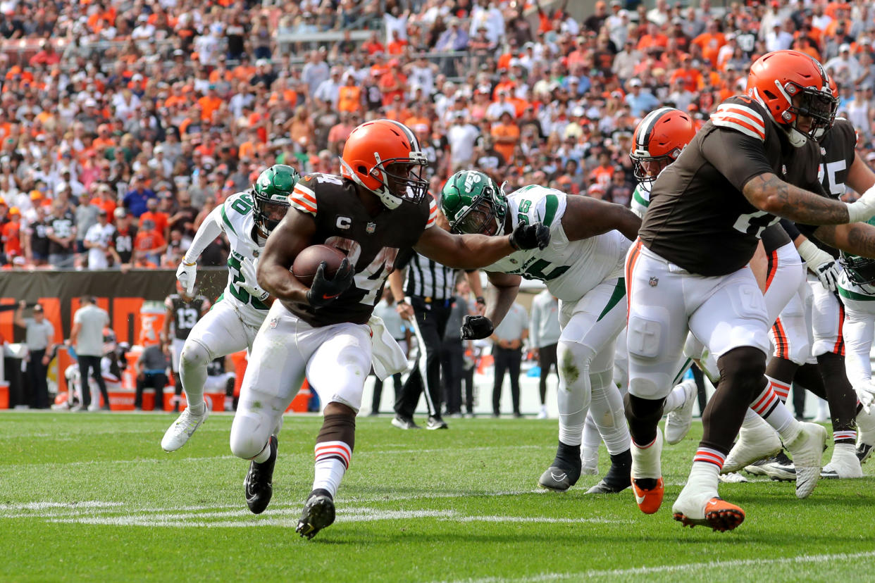 CLEVELAND, OH - SEPTEMBER 18: Cleveland Browns running back Nick Chubb (24) runs behind the block of Cleveland Browns offensive tackle Jedrick Wills Jr. (71) as he scores on a 7-yard run during the fourth quarter of the National Football League game between the New York Jets and Cleveland Browns on September 18, 2022, at FirstEnergy Stadium in Cleveland, OH. (Photo by Frank Jansky/Icon Sportswire via Getty Images)