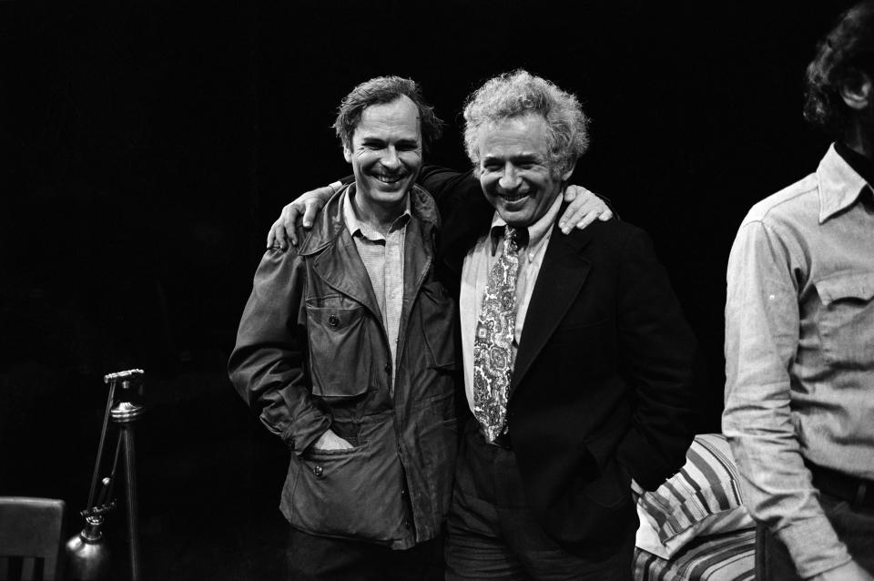 From left, American actor Rip Torn, author Norman Mailer (1923 - 2007), and playwright and theatre director Jack Gelber (1932 - 2003) (mostly obscured) on the set of Gelber's production of the play 'The Kitchen' (by Arnold Wesker) at the 81st Street Theatre, New York, New York, June 1966. Torn played the male lead in the production. (Photo by Susan Wood/Getty Images)