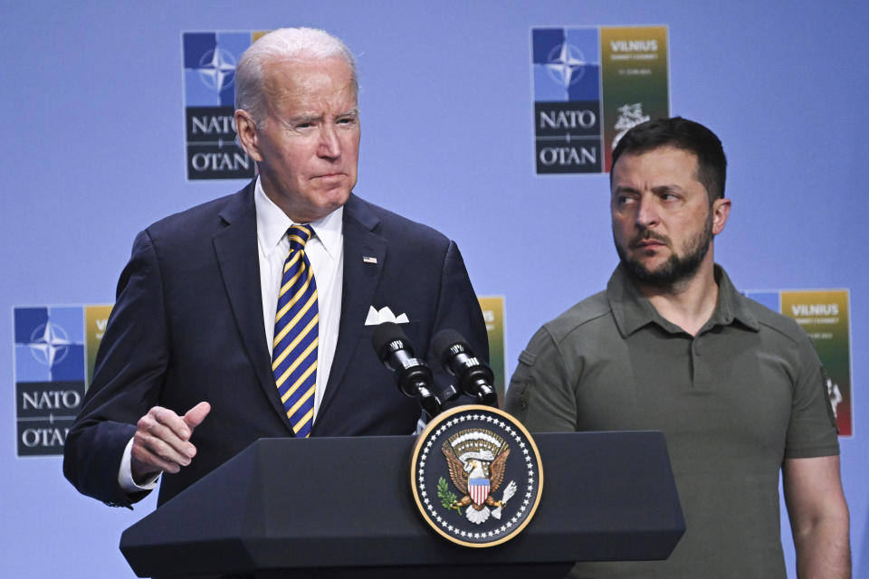 FILE - President Joe Biden, left, speaks at an event with G7 leaders and Ukrainian President Volodymyr Zelensky during the NATO Summit, in Vilnius, Lithuania, July 12, 2023. United States President Joe Biden and his counterparts meet in Washington for a three-day summit beginning Tuesday, July 9, 2024 to mark the military alliance's 75th anniversary, with Russian troops pressing their advantave along Ukraine's eastern front in the third year of war. (Paul Ellis/Pool Photo via AP, File)