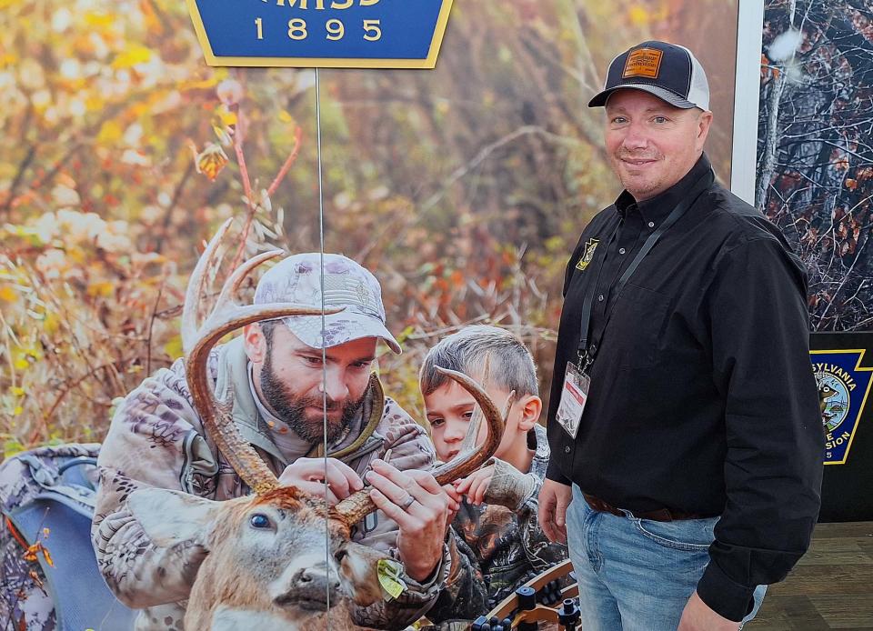 Matt Morrett, marketing director for the Pennsylvania Game Commission, discusses the variety of hunting seasons that area available in Pennsylvania Sunday at the Great American Outdoor Show in Harrisburg.