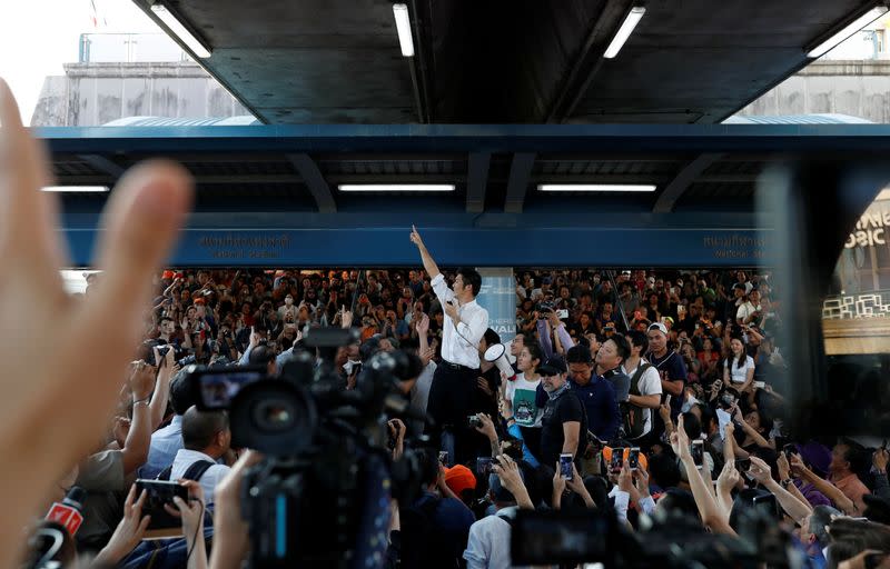 Thanathorn of Thailand's progressive Future Forward Party gestures to his supporters at a sudden unauthorised rally in Bangkok