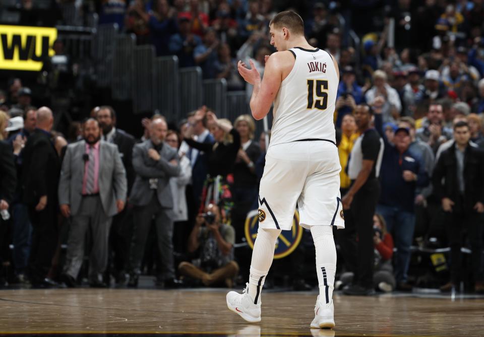 Denver Nuggets center Nikola Jokic claps as time runs out in the second half of Game 1 of an NBA basketball second-round playoff series against the Portland Trail Blazers, Monday, April 29, 2019, in Denver. The Nuggets won 121-113. (AP Photo/David Zalubowski)