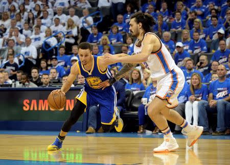 May 22, 2016; Oklahoma City, OK, USA; Golden State Warriors guard Stephen Curry (30) drives to the basket as Oklahoma City Thunder center Steven Adams (12) defends during the third quarter in game three of the Western conference finals of the NBA Playoffs at Chesapeake Energy Arena. Mandatory Credit: Mark D. Smith-USA TODAY Sports