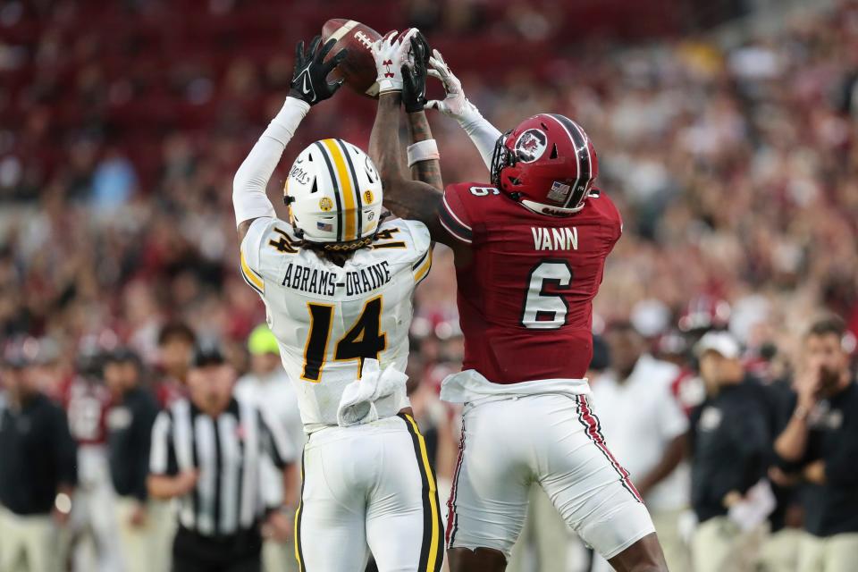 Missouri defensive back Kris Abrams-Draine (14) breaks up a pass attempt to South Carolina wide receiver Josh Vann (6) during the second half of an NCAA college football game on Saturday, Oct. 29, 2022, in Columbia, S.C. (AP Photo/Artie Walker Jr.)