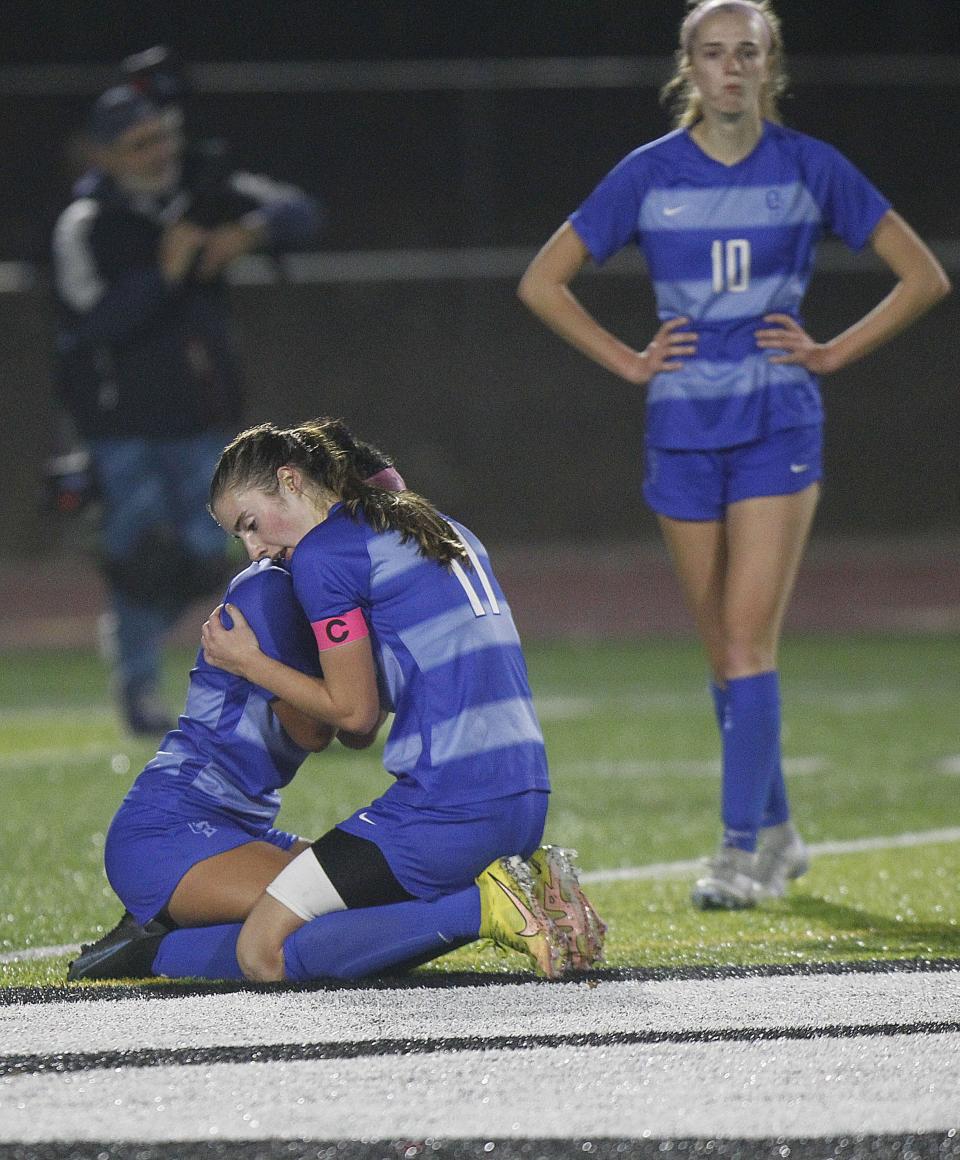 Olentangy Berlin's Ali de Gracia (left) and Roisin Kennedy console one another following the a 1-0 loss to Olentangy Orange on Nov. 1. Also pictured is Emma Budic.