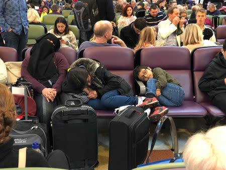 Stranded passengers are seen sleeping at Gatwick Airport, Britain, December 20, 2018 in this picture obtained from social media. Ani Kochiashvili/via REUTERS