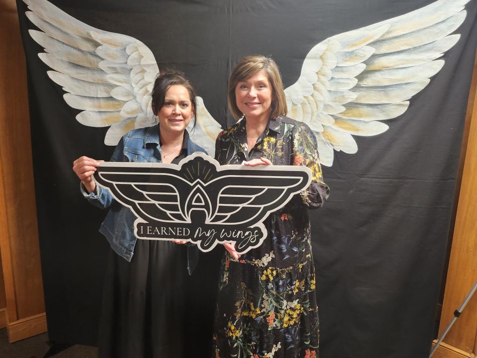 Amarillo Angels Executive Director Gwen Hicks poses with Amarillo Hispanic Chamber of Commerce representative Ann Romo as they celebrate the Amarillo Angels' seventh anniversary with a grand opening of its new office and a ribbon cutting Wednesday afternoon.