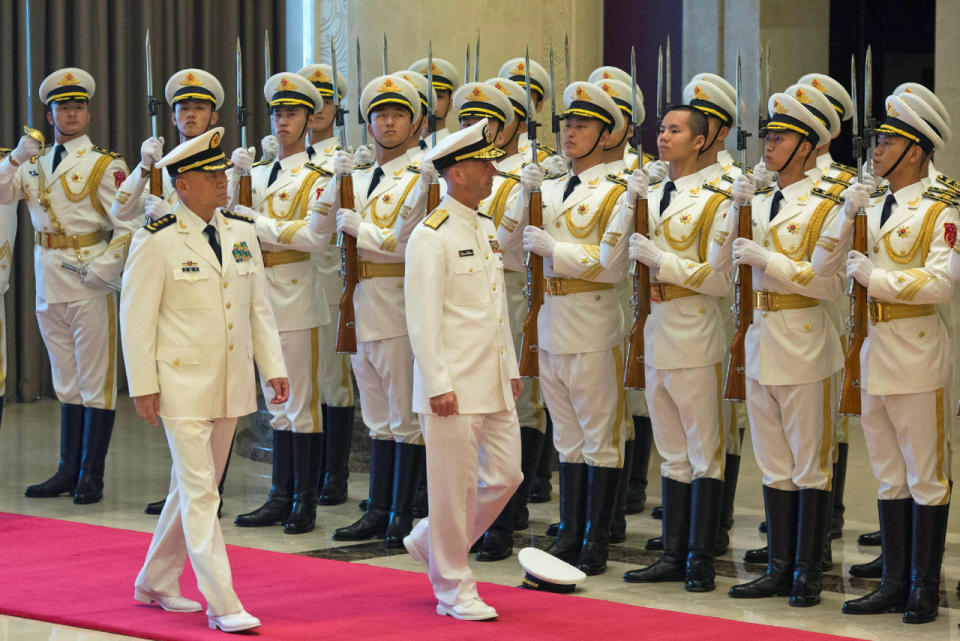 Admiral Richardson walks past honor guard 