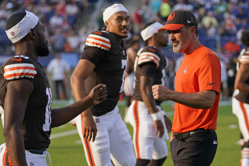 Cleveland Browns coach Kevin Stefanski, right, and wide receiver David Bell, left, bump fists before the team's Hall of Fame NFL football preseason game against the New York Jets, Thursday, Aug. 3, 2023, in Canton, Ohio. (AP Photo/Sue Ogrocki )