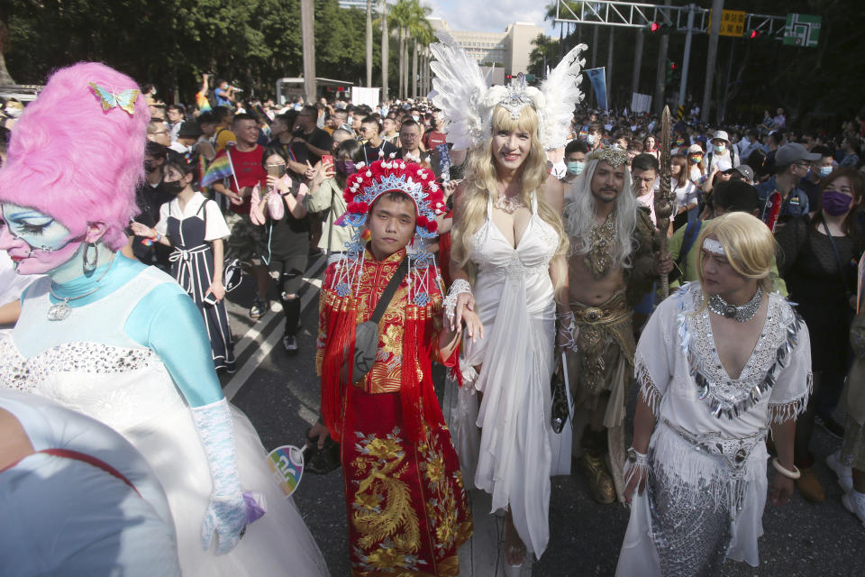 Participants march through a street during a pride parade in Taipei, Taiwan, Saturday, Oct. 31, 2020. (AP Photo/Chiang Ying-ying)