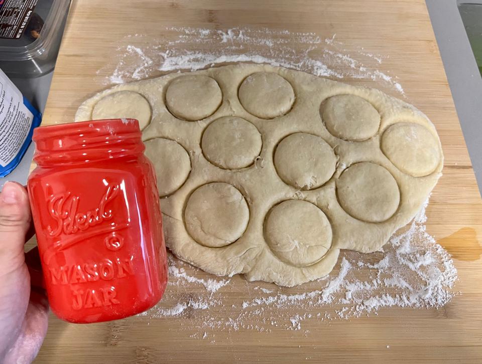 The author used a mason jar to cut the shape of a scone out of the dough.