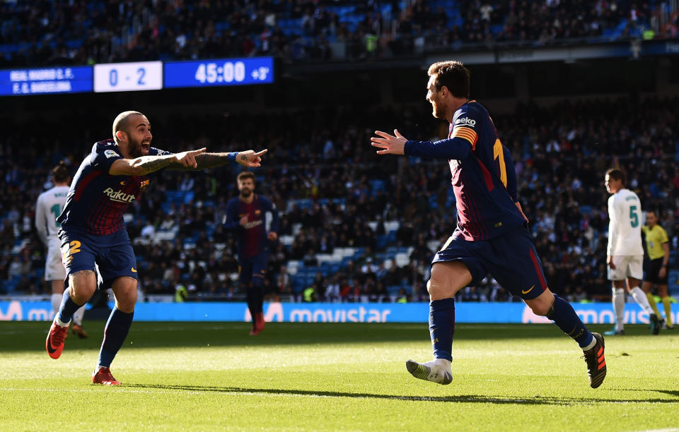 Lionel Messi (right) and Aleix Vidal celebrate Vidal’s goal. (Getty)